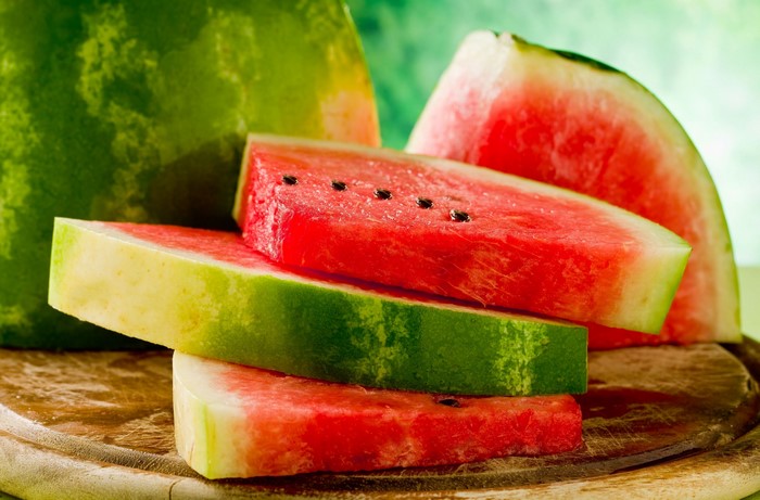 Slices of watermelon on a wooden board