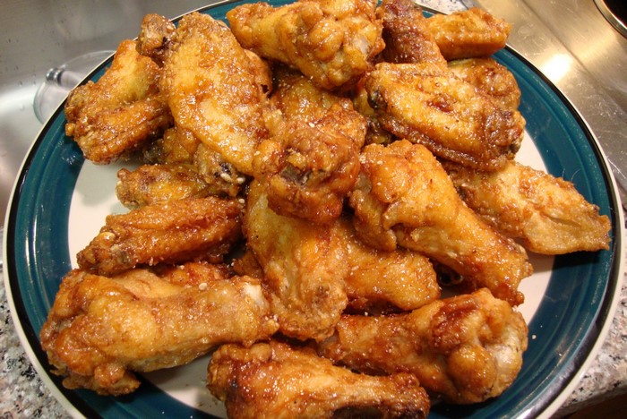 Plate of golden brown fried chicken wings
