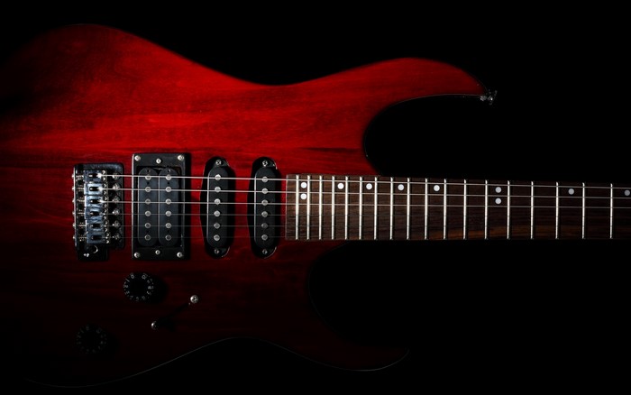 Red electric guitar close-up