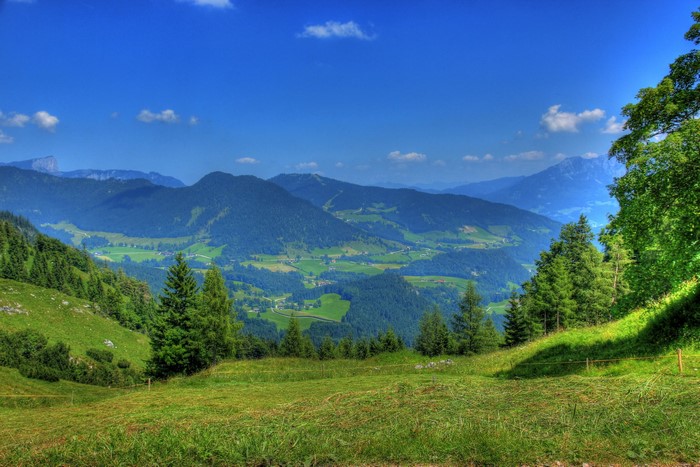 Mountain landscape with green valleys and blue sky