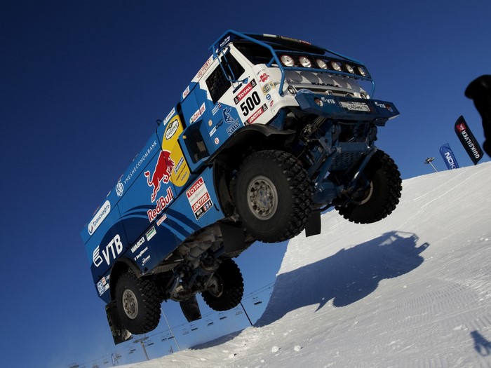 KAMAZ truck flying over a snowy slope