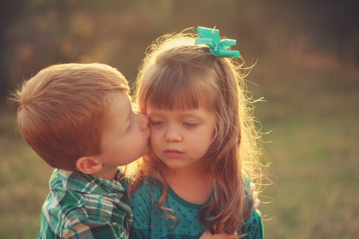 Boy kissing a girl