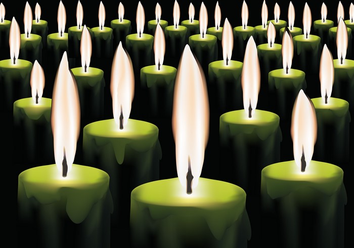 Many green candles with flames