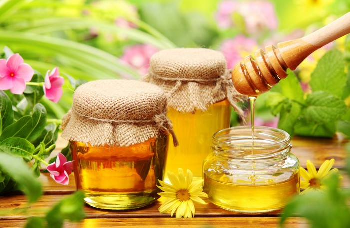 Honey Jars with Honey Dipper and Flowers
