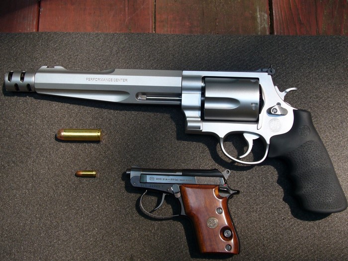 Smith & Wesson Revolver and Small Pistol with Ammunition