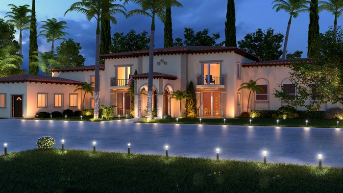 Luxury villa with palm trees at dusk