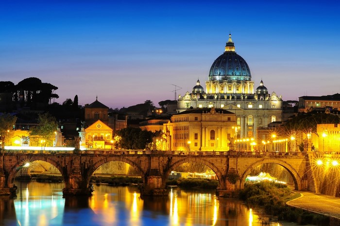 St. Peter's Basilica and Ponte Sant'Angelo at night in Rome