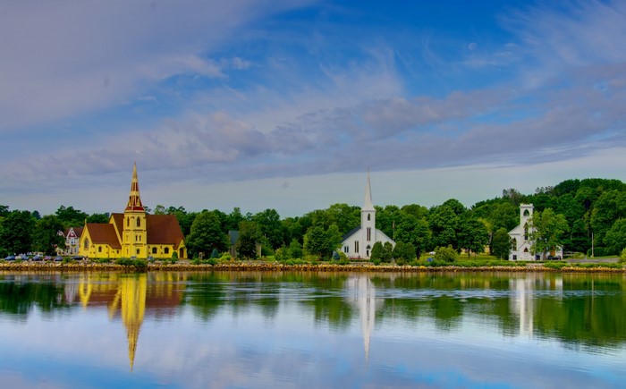 Churches reflected in water in Lunenburg, Nova Scotia, Canada