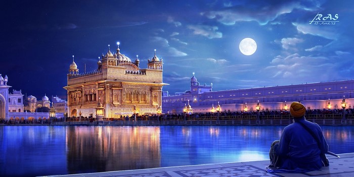Golden Temple at night with a man looking on