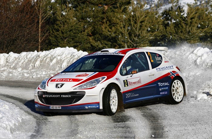 Peugeot 207 rally car on a snowy road