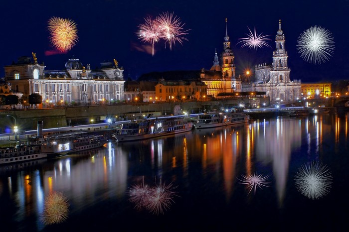Dresden skyline with fireworks over the Elbe River at night