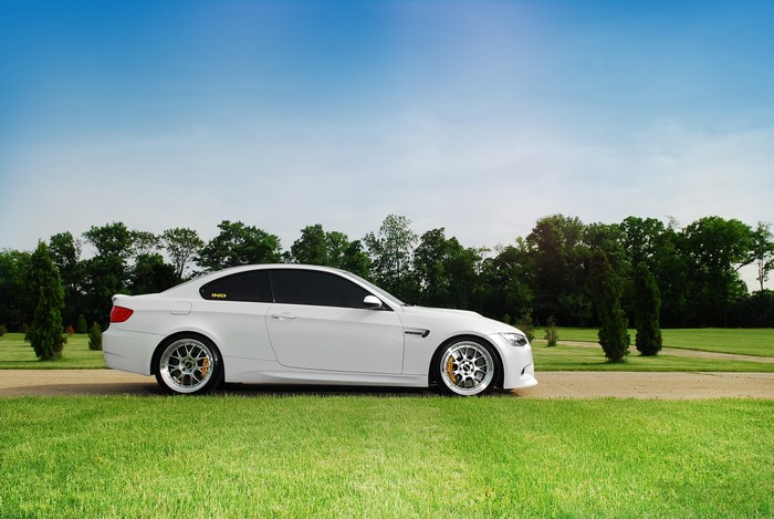 White BMW M3 E92 on Grass