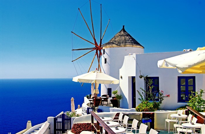 Santorini windmill cafe overlooking the Aegean Sea