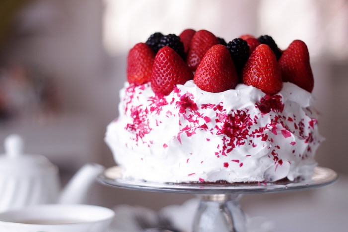 White cake with strawberries and blackberries