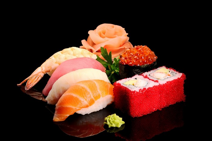 Sushi platter with salmon, tuna, shrimp, caviar, and ginger