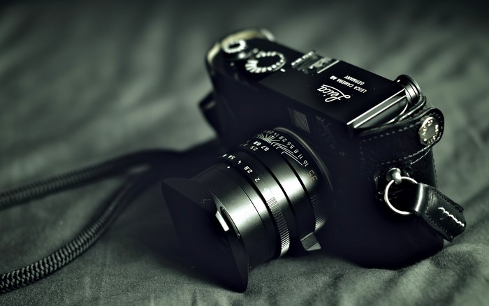 Leica camera with lens and strap
