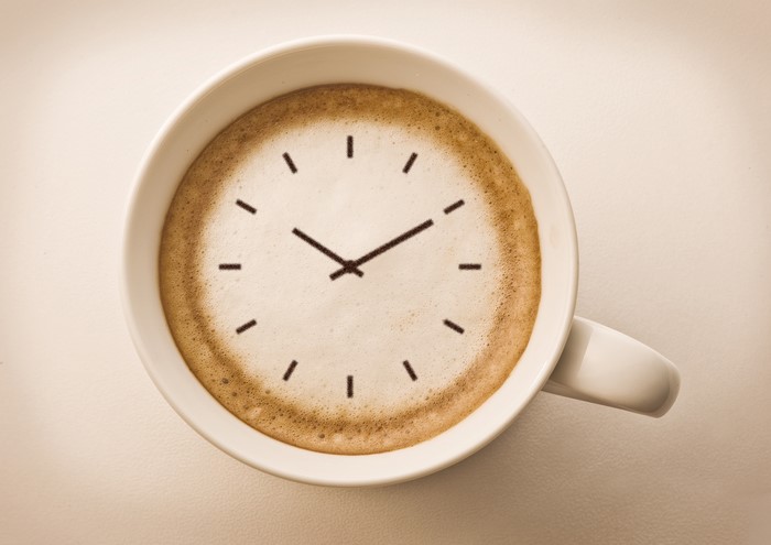 Coffee cup with clock face made of foam