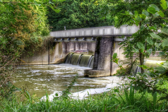 Bridge over a dam with waterfalls in Bad Mergentheim, Germany