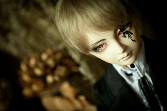 Doll with blonde hair and suit