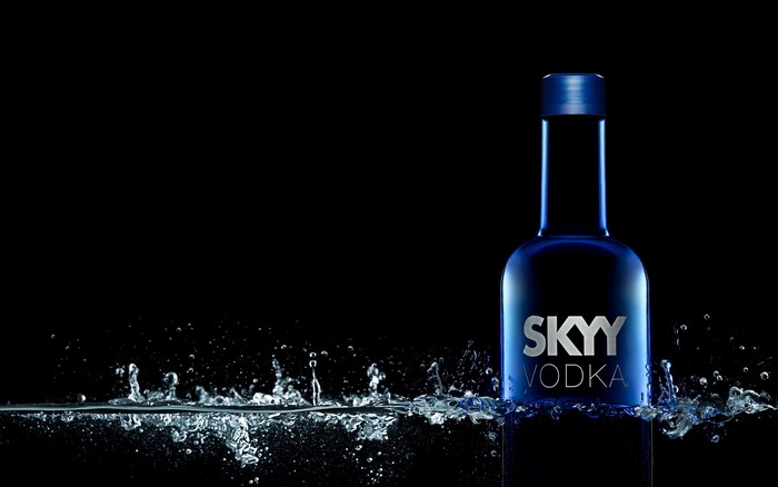 SKYY Vodka bottle in water splashes
