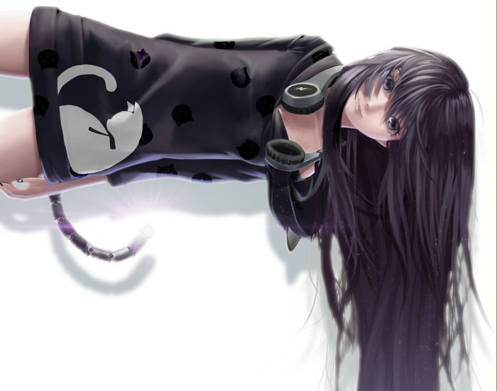 Girl with headphones and cat-themed clothing