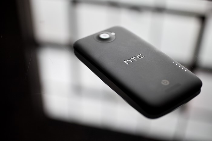 HTC One X smartphone on a reflective surface