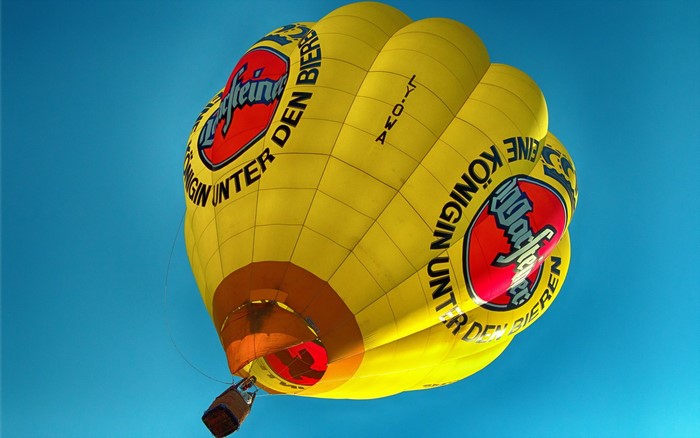 Yellow hot air balloon with beer logo