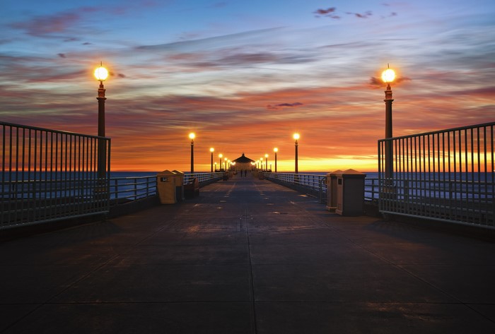 Pier with street lights at sunset in California