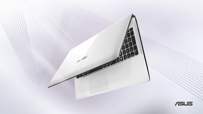 White Asus laptop with keyboard and touchpad