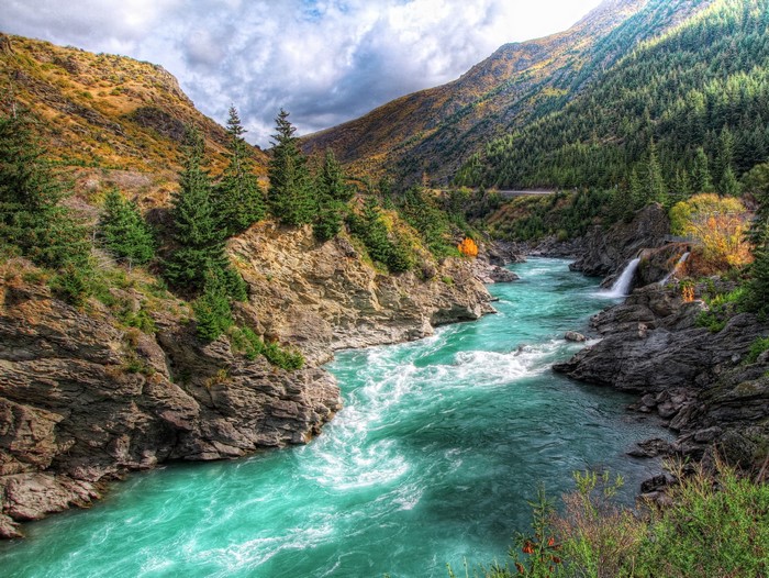 Turquoise river flowing through a rocky canyon in New Zealand