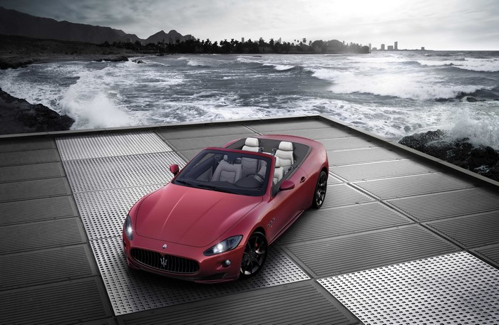 Maserati GranCabrio Sport convertible on a platform by the ocean