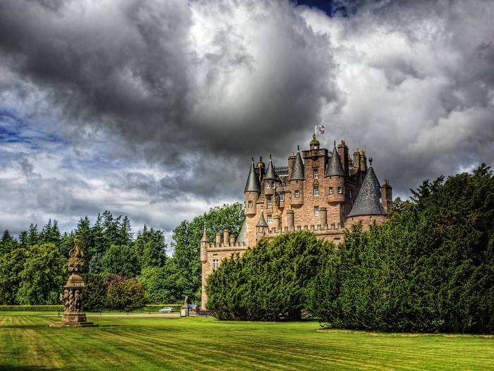 Glamis Castle in Scotland with dramatic clouds