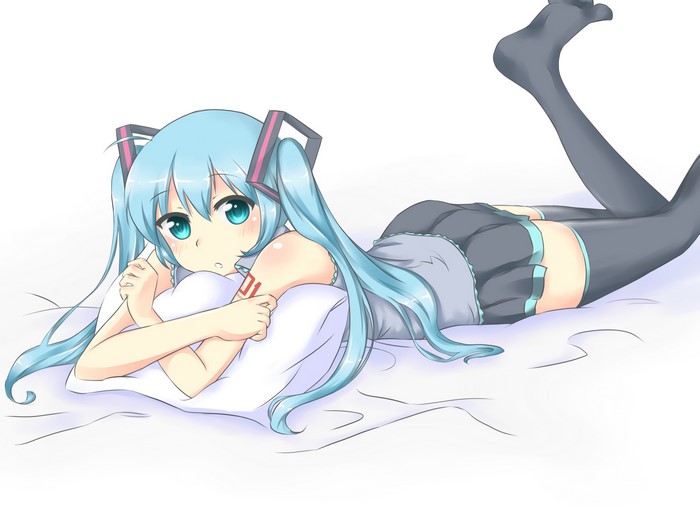 Hatsune Miku lying on a bed