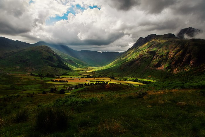 Valley and mountains in England under dramatic clouds