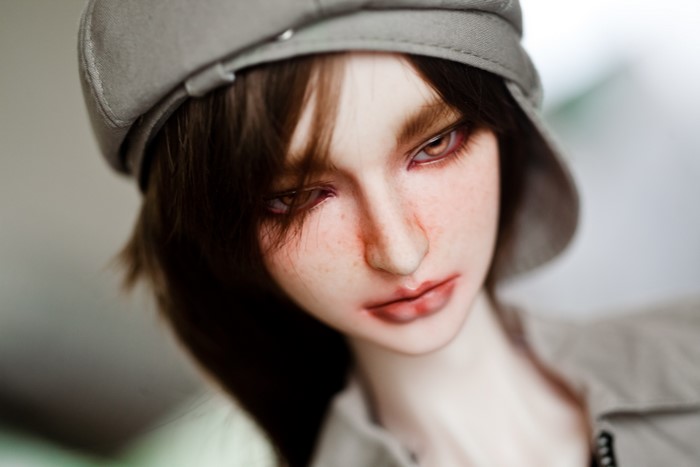 Doll wearing a cap