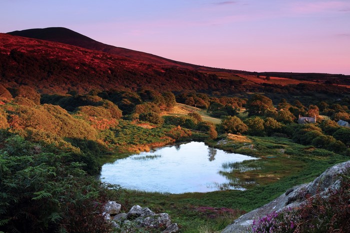 Sunset over Welsh hills with a lake