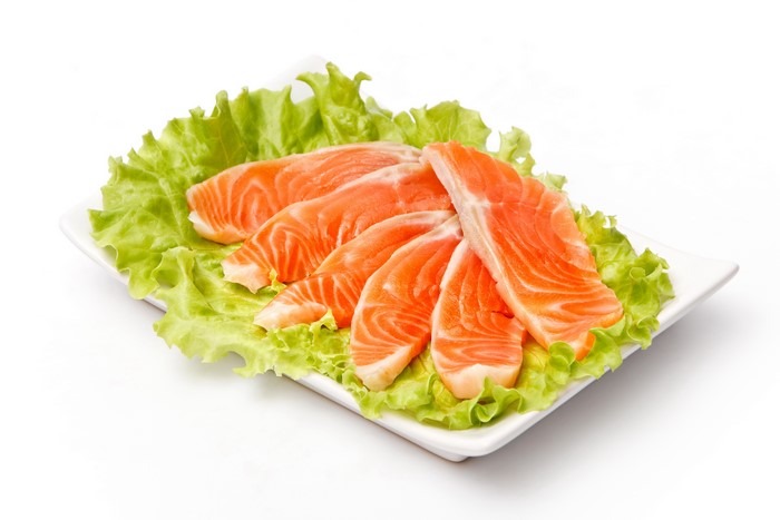 Salmon slices on lettuce
