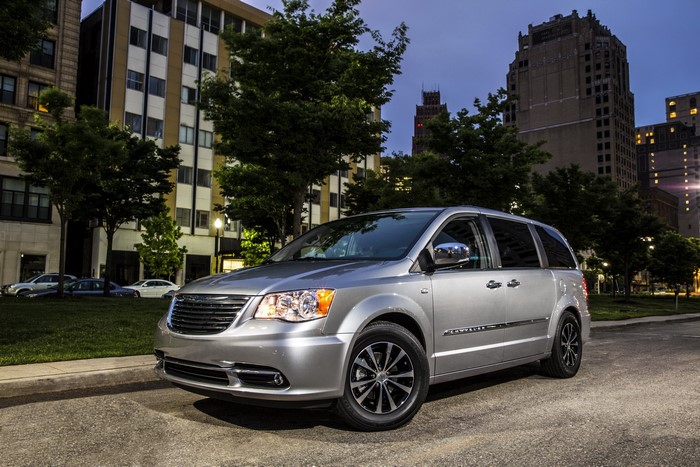 Silver 2014 Chrysler Town and Country minivan on a street