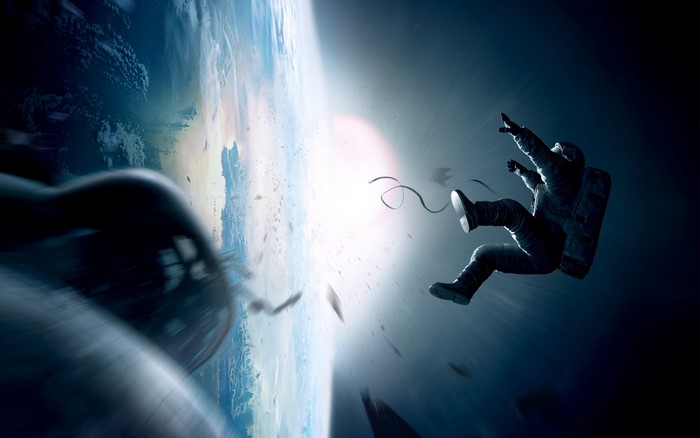 Astronaut floating in space above Earth