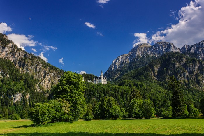 Neuschwanstein Castle in Bavaria, Germany, with Mountains
