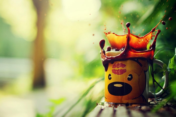 Coffee splash on a bear mug with lipstick kiss