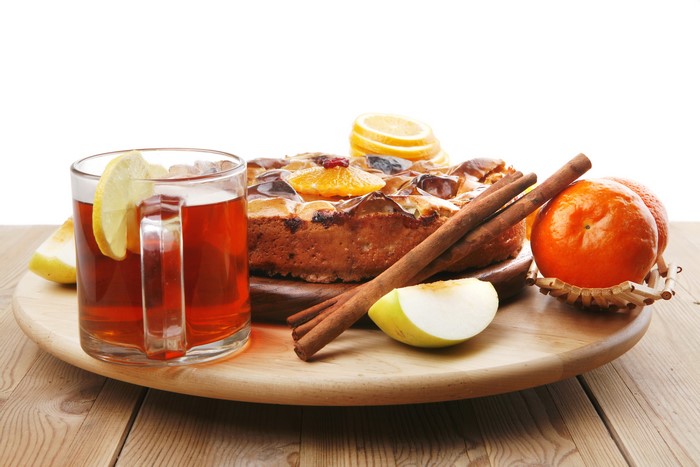 Tea, Pie, Cinnamon, and Fruit on a Wooden Platter