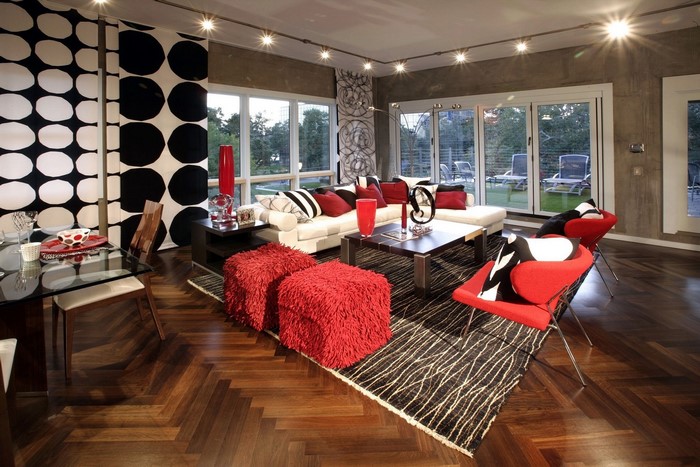 Modern living room with white sofa and red accents