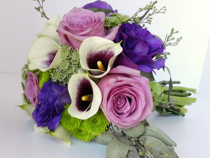 Purple and white calla lily and rose bouquet