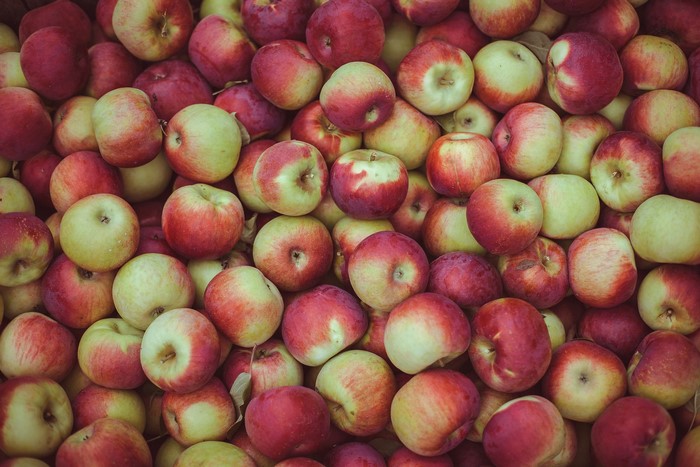A pile of red and green apples