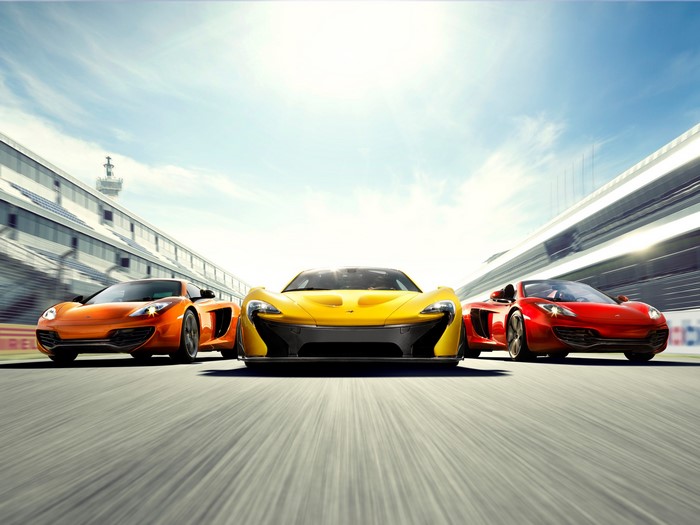 McLaren P1 and MP4-12C cars on a racetrack