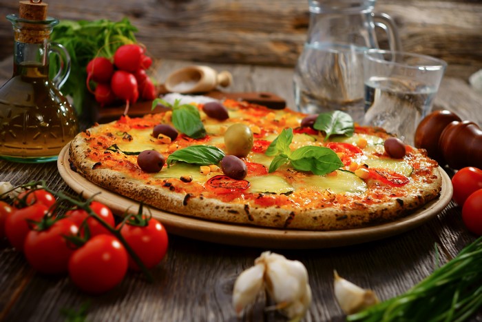 Pizza with Tomatoes, Olives, and Basil
