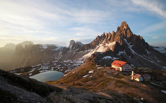 Mountain landscape with lake and buildings