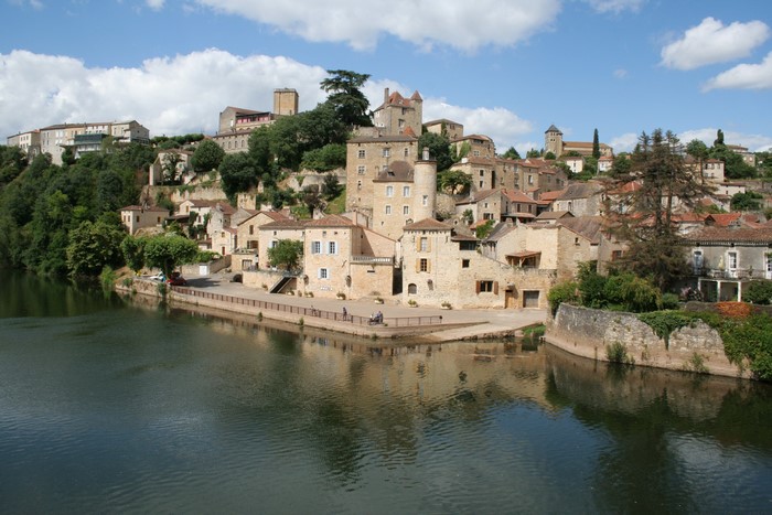 Puy L'Eveque, France, riverside town with historic buildings