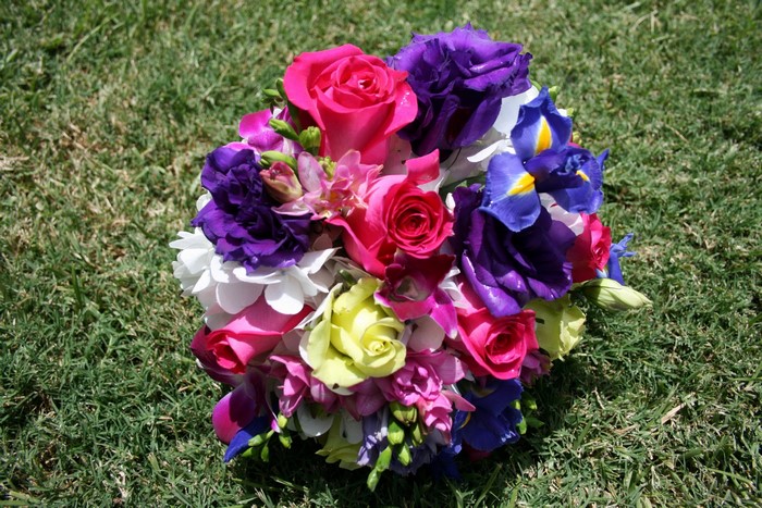 Bouquet of Roses and Irises on Grass